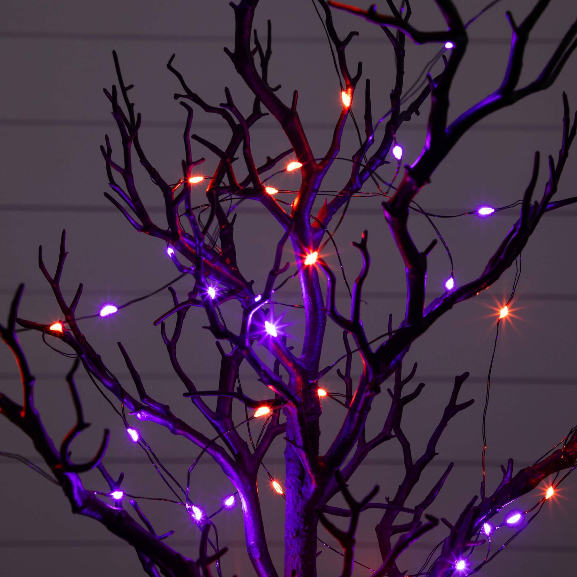 2ft. Pre-Lit Artificial Halloween Black Spooky Twig Tree with 60 Orange & Purple Copper Wire String LED Lights